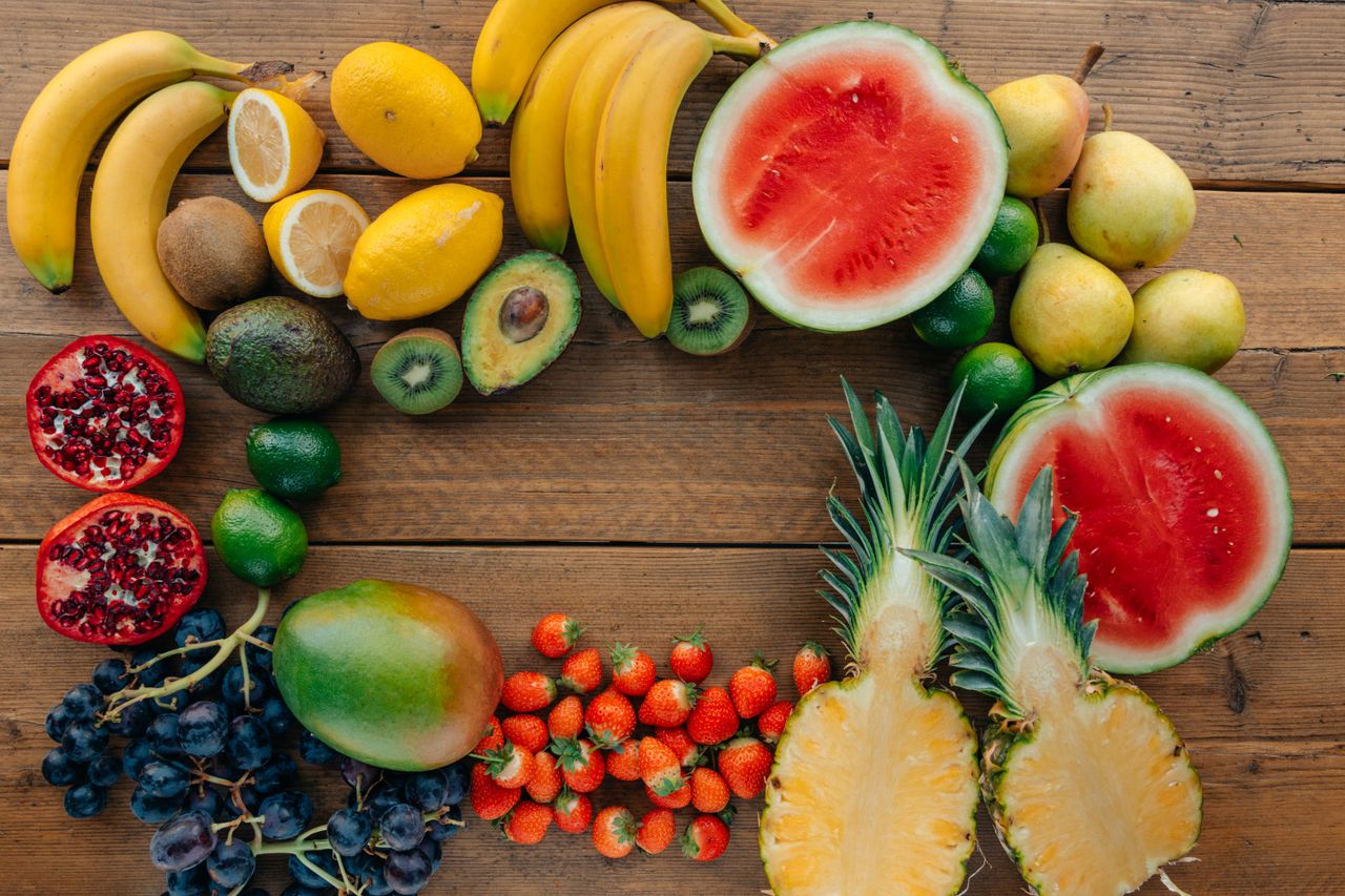 services-02 Colorful assortment of fresh fruits in a flatlay on wooden surface, perfect for healthy lifestyle themes.